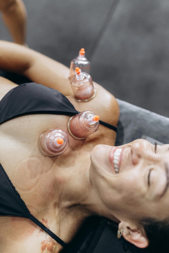 pexels photo 27730481 27730481 A woman enjoying a relaxing cupping therapy session for health and wellness.